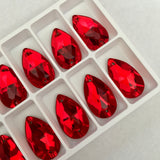 real photo of swarovski crystal sew on stones article 3230 drop teardrop shape in light siam red